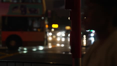 Nighttime-side-view-of-an-out-of-focus-busy-street-in-Hong-Kong