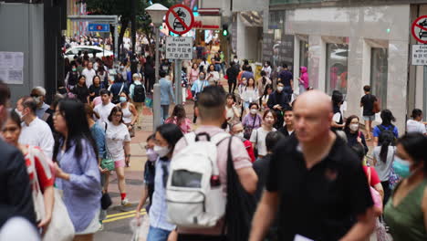 Static-shot-in-Hong-Kong-of-a-very-busy-street-filled-with-people-walking-in-all-directions