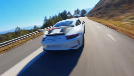 Epic-FPV-aerial-following-a-white-Porsche-through-the-Spanish-countryside