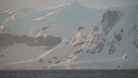 Nice-Antarctica-coastline-with-mountains-in-golden-sunset-or-sunrise-light