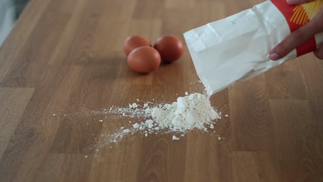 flour-on-the-table-in-a-mound-to-start-preparing-egg-pasta-dough