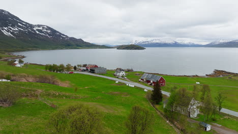 Picturesque-Landscape-Of-Scandinavian-Agriculture-Field-With-Farm-Houses-Near-The-Coastal-In-Northern-Norway