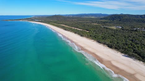 Peaceful-Waves-on-Maggies-Beach,-Cabarita-in-Northern-Rivers,-Tweed-Shire,-Bogangar,-New-South-Wales,-Australia-Aerial,-Pull-Back-Shot