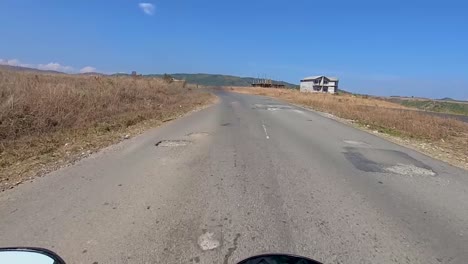 motorcycle-rider-view-of-different-mountain-curvy-road-landscape-at-day-video-is-taken-at-dawki-meghalaya-north-east-india-on-July-06-2023