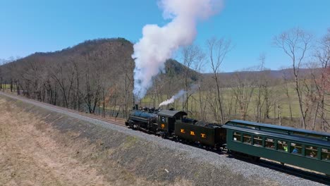 Aerial-View-of-EBT's-Narrow-Gauge-Restored-Antique-Steam-Passenger-Train-Passing-Approaching-With-Steam-and-Smoke-on-a-Clear-Sunny-Day