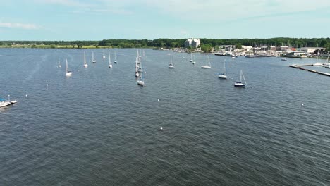 High-angle-clip-with-drone-of-anchored-sailboats