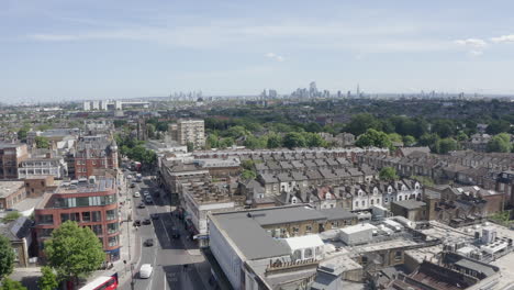 Archway-aerial-with-downtown-London-seen-in-distance,-England-UK