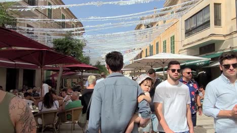 walking-through-the-market-in-the-town-of-santanyi-on-the-island-of-mallorca
