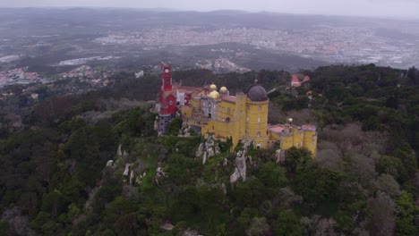Orbit-around-Palácio-da-Pena-famous-castle-at-Portugal,-aerial