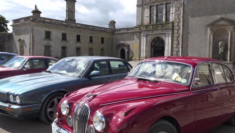 Elegant-Jaguars-on-display-outside-a-stately-home-on-a-classic-car-rally-in-Waterford-Ireland