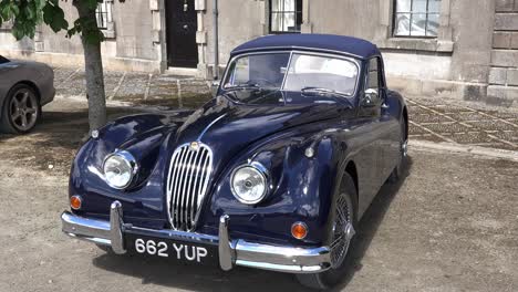 The-Beauty-of-a-Jaguar-from-another-era-a-XK120-sits-in-a-courtyard-on-display-on-a-vintage-rally-in-Waterford-Ireland-elegant-beauty-on-a-warm-spring-morning