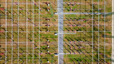 Bird's-Eye-View-Over-High-Voltage-Substation-In-Summer---drone-shot