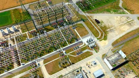 Electrical-Transformer-Substation-In-Summer-Landscape---aerial-drone-shot