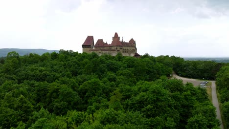 Flying-Towards-Kreuzenstein-Castle-On-A-Cloudy-Day-In-Austria---drone-shot