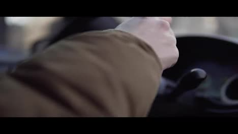 Hands-of-a-man-driving-a-car-in-4k