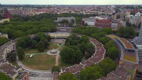 Gorgeous-aerial-top-view-flight-Ghetto-Building-Mehringplatz-place-city-Berlin-steglitz,-Germany-Summer-day-2023