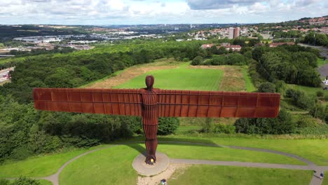 Wide-aerial-view-and-flyover-of-the-Angel-of-the-North-statue-in-sunny-conditions