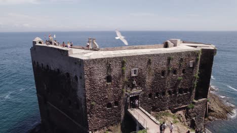 Aerial-view-orbiting-historic-penal-colony-Fort-of-São-João-Baptista-das-Berlengas-sunny-coastal-landmark