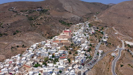 Aerial:-Flying-over-the-Catholic-Saint-George-church-of-Ermoupoli-city-in-Syros-island,-Greece-on-a-sunny-day