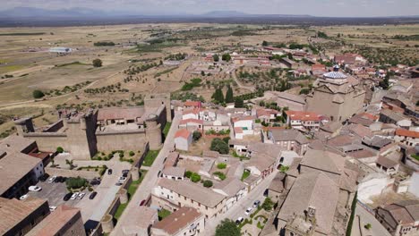 Establishing-aerial-view-over-Oropesa-small-Spanish-town-neighbourhood-buildings-and-castle-in-the-scenic-Toledo-province