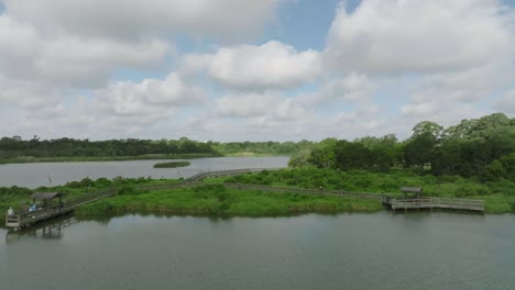 Aerial-drone-view-people-fishing-and-walking-on-the-boardwalk-over-Armand-Bayou-at-Bay-Area-Park-in-Pasadena-Texas