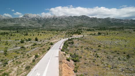 One-road-is-meandering-through-karst-region-Velebit-mountain,-the-view-from-above-in-Zadar-county,-Croatia