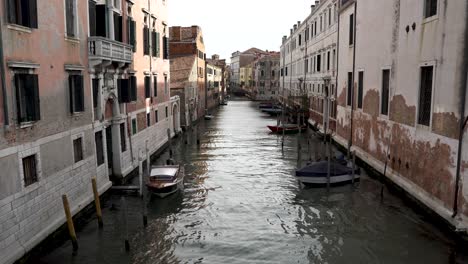 Idyllic-Charming-View-Of-Narrow-Venice-Canal-During-Golden-Hour-Sunlight