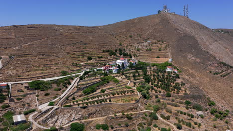 Aerial:-Slow-panoramic-drone-shot-of-Monastery-of-Saint-Barbara-in-Ermoupoli-city-of-Syros-island,-Greece