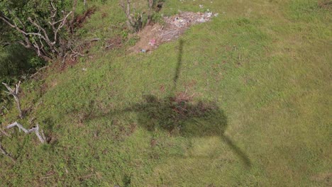 Helicopter-Landing-In-Remote-Asian-Village-Shadow-Mountians