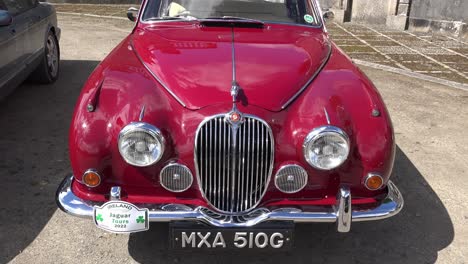 stunning-red-vintage-Jaguar-on-a-vintage-Rally-in-Waterford-Ireland-in-early-spring