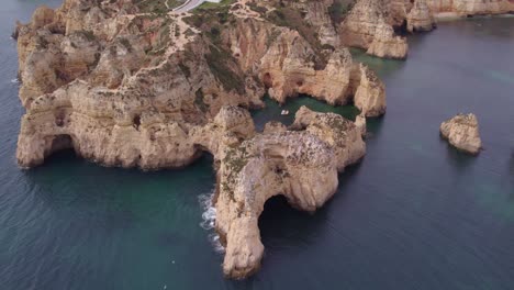 Wide-shot-of-famous-Ponta-da-Piedade-Portugal-during-day-time,-aerial