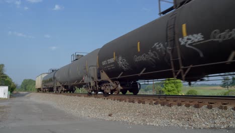 Freight-Train-with-Tank-cars-at-a-railroad-cross