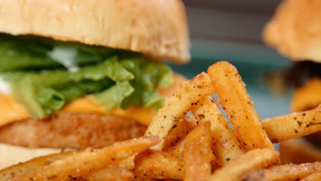 Close-Up-Pan-of-French-Fries-Chips-with-Meat-Free-Chicken-Burger-and-Cheese-Burger