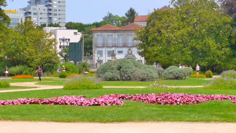 Establishing-shot,-showing-the-beautiful-pink-flowers-in-the-Crystal-Palace-Gardens-in-Porto-during-summer-time
