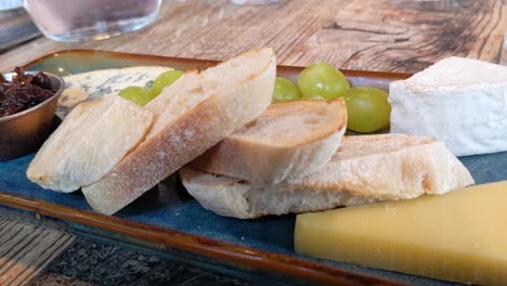 Elegant-Cheese-Board-with-Cheddar-Camembert-Blue-Cheese-Rustic-Bread-and-Chutney