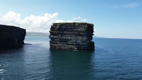 Low-Drone-shot-flying-away-from-Downpatrick-Head-revealing-more-cliffs