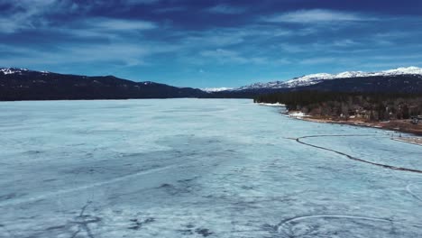 Flying-Over-Frozen-Payette-Lake-During-Winter