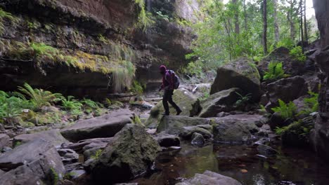 Indigenous-Australian-girl-crossing-a-canyon-in-the-Blue-Mountains,-NSW-Australia