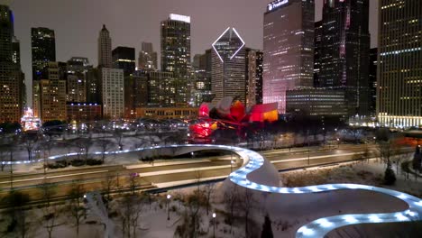 Chicago-IL-USA,-Aerial-View-of-Millennium-Park-at-Winter-Night,-Lights-on-Skyscrapers-and-Traffic