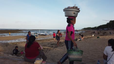 Traditional-Asian-Street-Seller-Head-Carrying-Food-at-Sanur-Beach-Bali-Indonesia