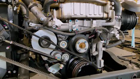 Close-up-shot-of-engine-vehicle-with-detail-of-main-engine-and-belt