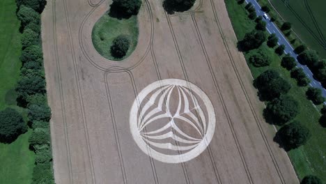 Mysterious-Warminster-crop-circle-aerial-view-above-geometric-pattern-carved-into-rural-countryside-farmland