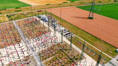 Aerial-View-Over-Powerlines-In-Electric-Substation---drone-shot