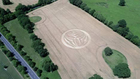 Aerial-view-descending-across-Warminster-2023-crop-circle-farmland-alongside-A36-highway