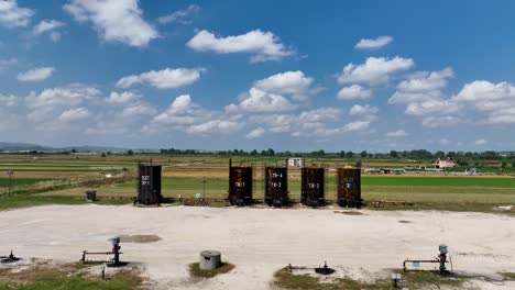 Fuel-deposit-tanks-near-a-farming-field-on-rural-land