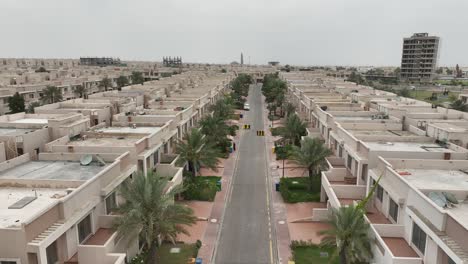 Aerial-Flying-Over-Urban-Road-At-Bahria-Town-Housing-Estate-In-Karachi