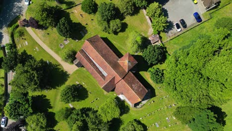 A-bird's-eye-view-roll-shot-of-St-Lawrence-the-Martyr-church-in-Godmersham