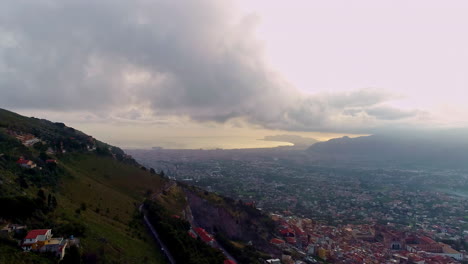 Aerial-dolly-out-drone-shot-of-the-city-of-Palermo-Italy-on-a-cloudy-day