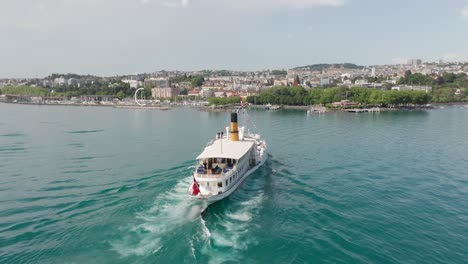 Aerial-of-beautiful-old-ferry-sailing-towards-the-city-of-Lausanne-in-Switzerland