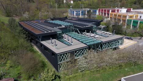 Aerial-of-the-International-Basketball-Federation-Headquarters-in-Mies,-Switzerland